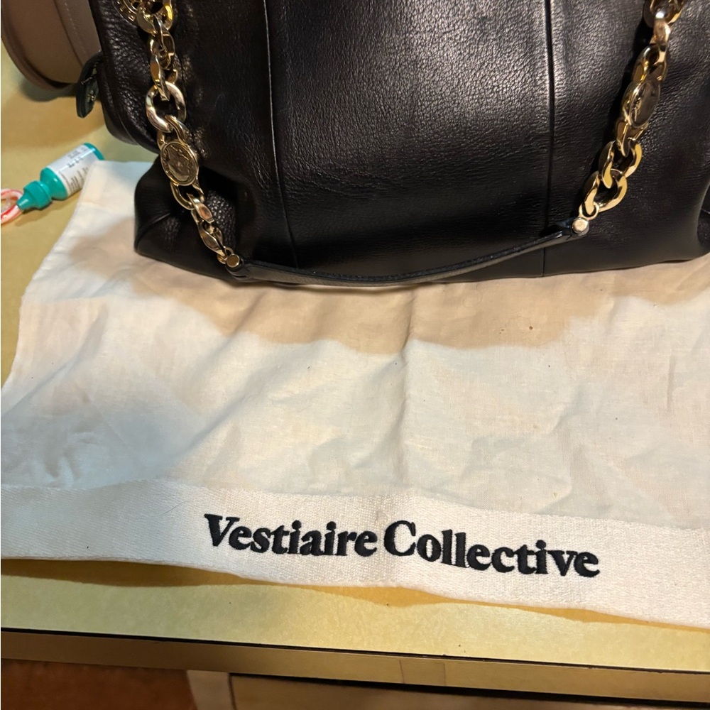 Bvlgari black leather shoulder bag with light gold heavy hardware.